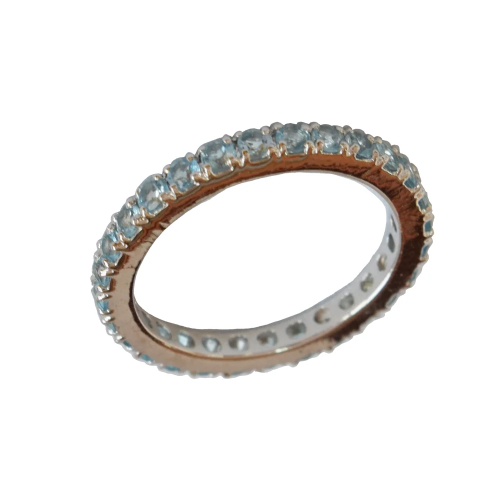 A Symphony of Elegance: Round Blue Topaz Full Eternity 925 Sterling Silver Ring (GSR79)