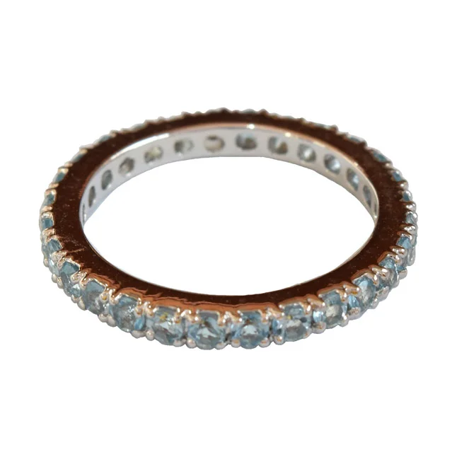A Symphony of Elegance: Round Blue Topaz Full Eternity 925 Sterling Silver Ring (GSR79)