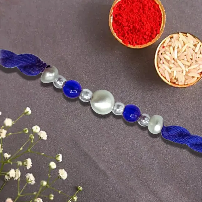 A Fine Pearl Rakhi Knotted With Blue Beads (SNRP-1)